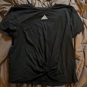 Adidas tshirt with a little knot in the front is a charcoal gray.